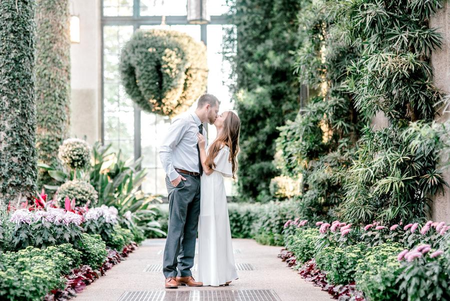 couple kissing at longwood gardens by clicke photography and philly in love blog