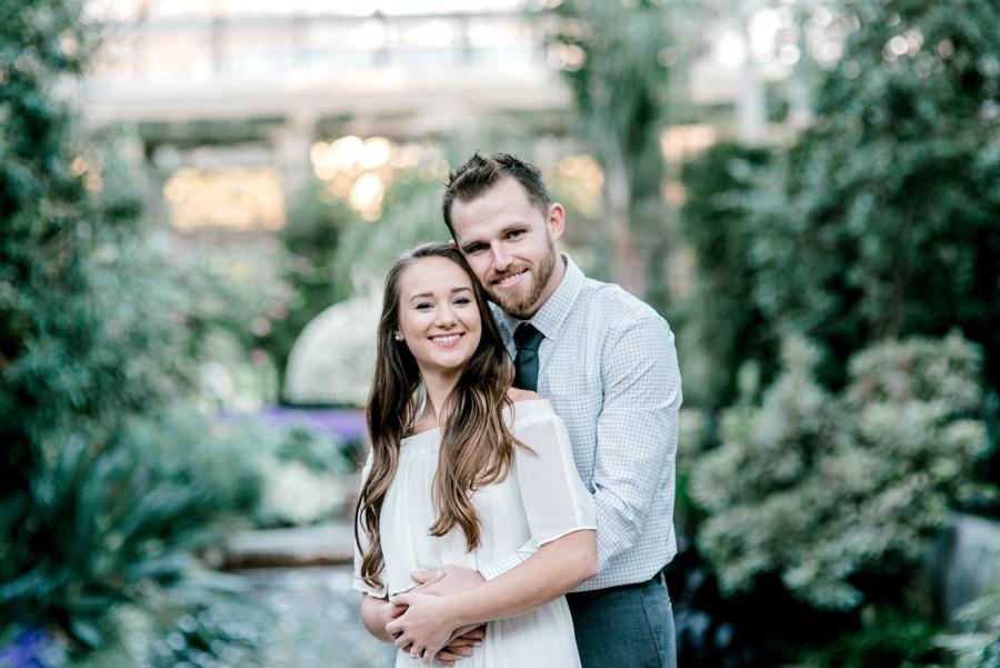 smiling couple at longwood gardens by clicke photography and philly in love blog
