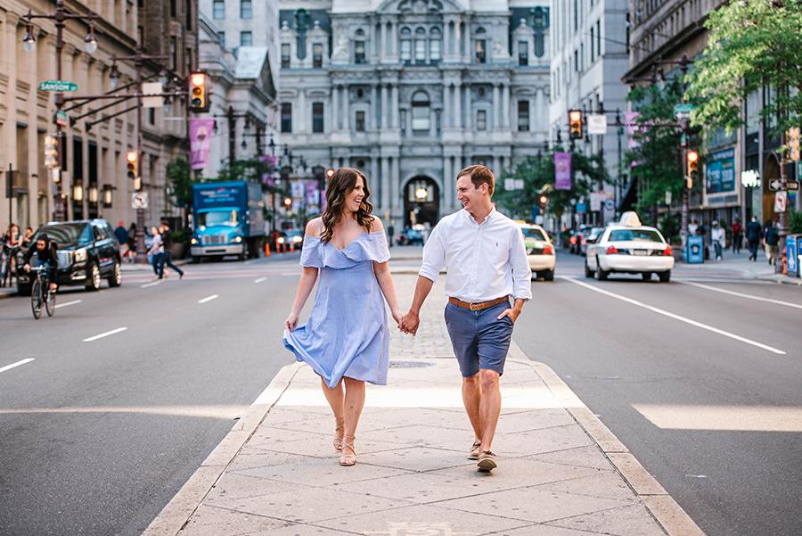 couple holding hands in city by Nicole Cordisco and Philly In Love
