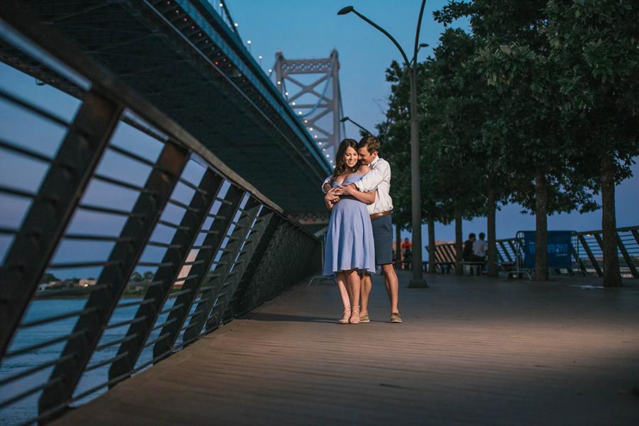 couple embrace at night by river by Nicole Cordisco Photography and Philly In Love