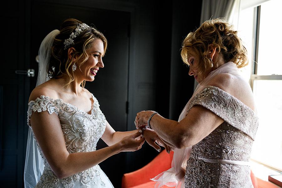 mother helping daughter on wedding day by daniel moyer photography