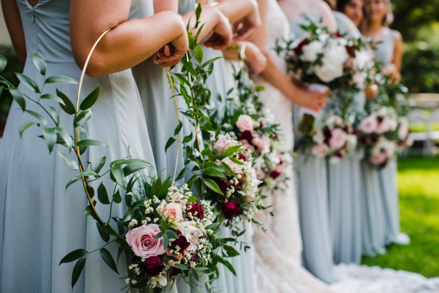 bridesmaids holding floral hoops