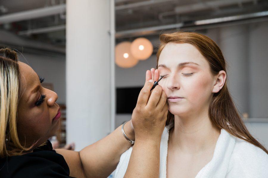 makeup artist Dolly Marshall applies eye makeup