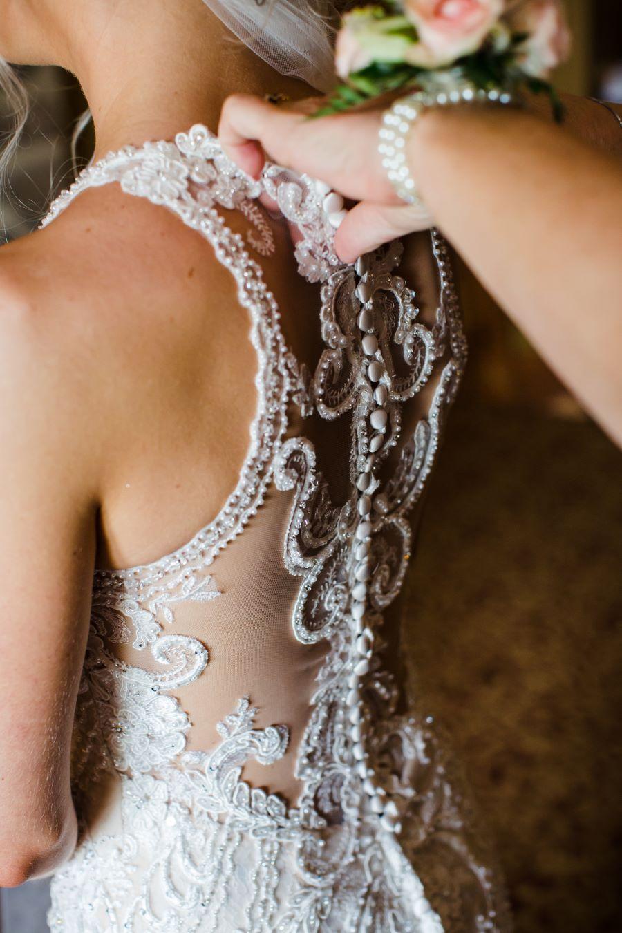 back of wedding dress details with lace and buttons
