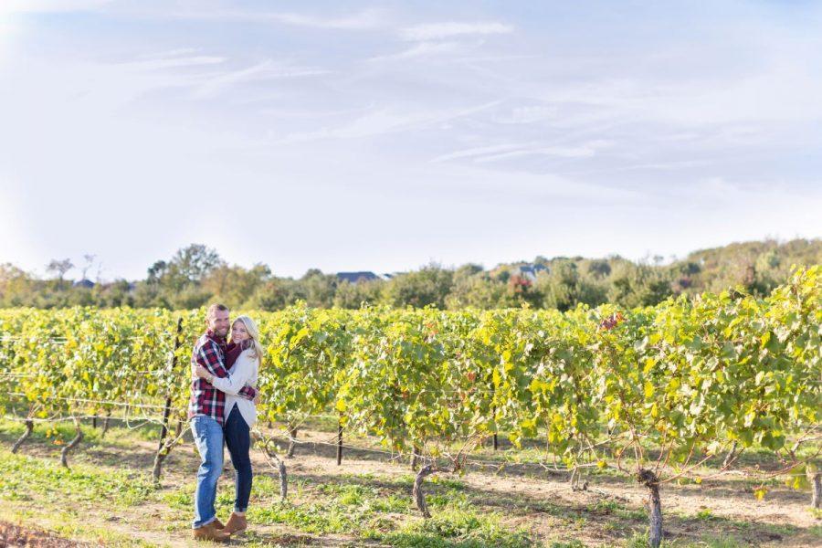 couple hugging in vineyard