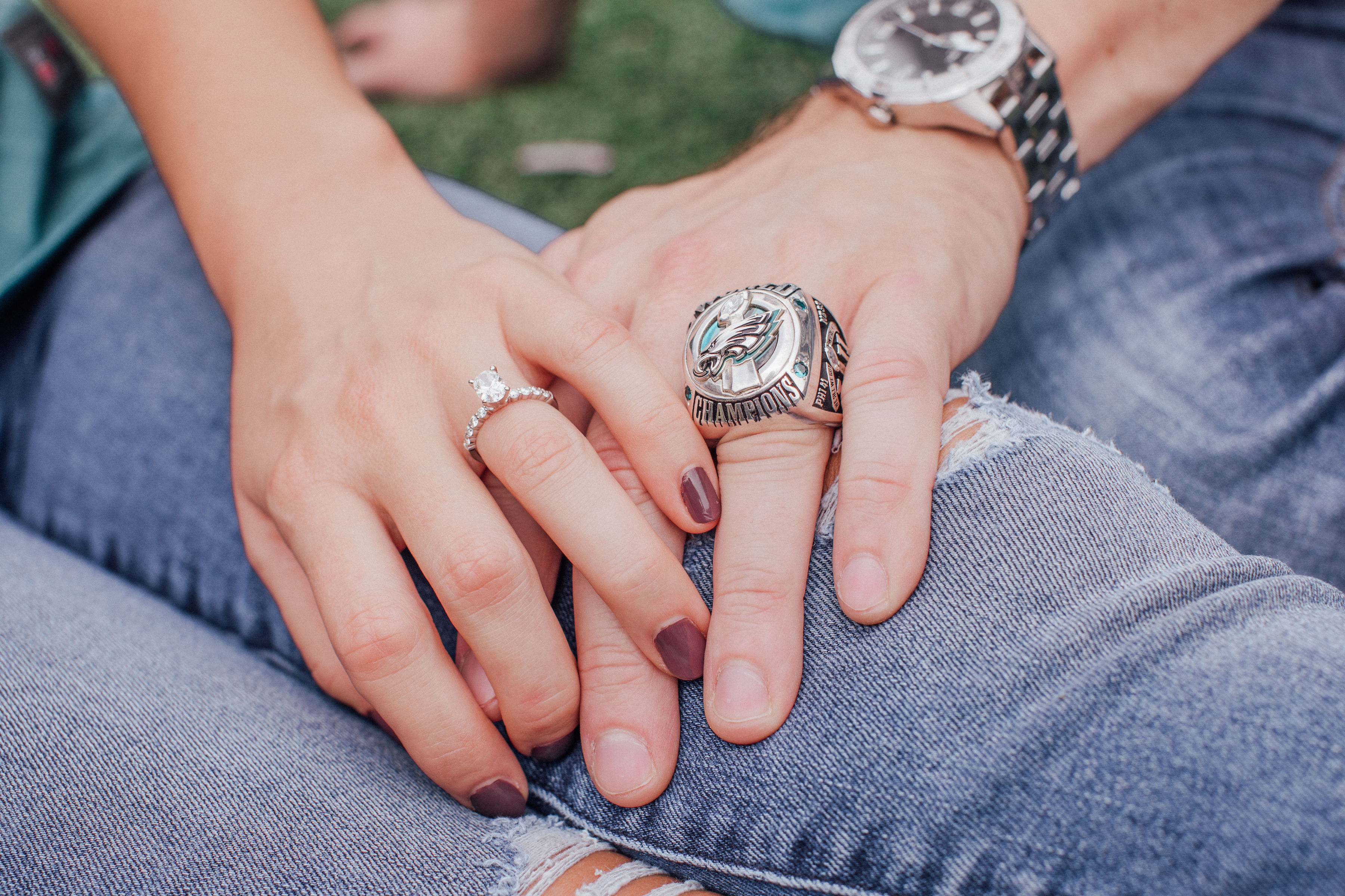 couple showing engagement ring