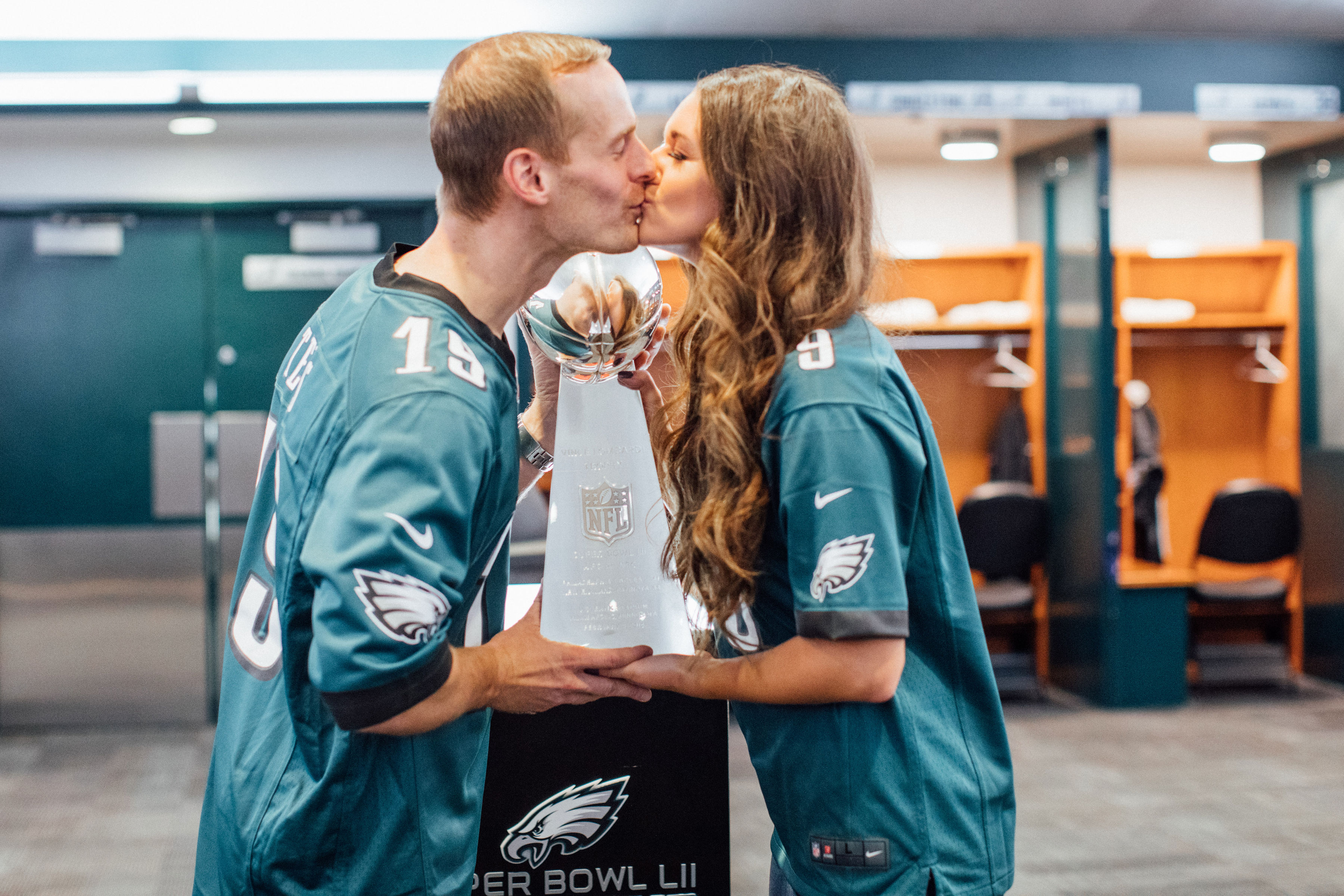 couple kissing in Eagles locker room