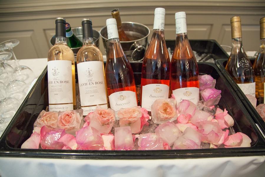 wine chilled on ice with rose petals
