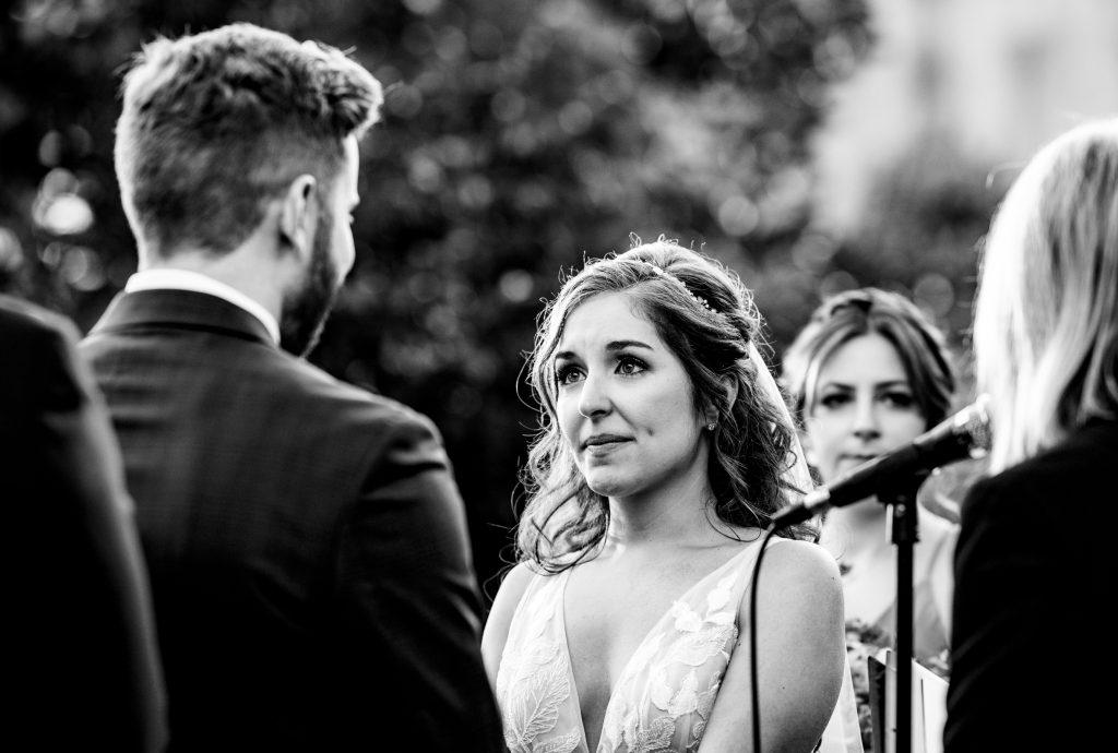 bride gazes into groom's eyes