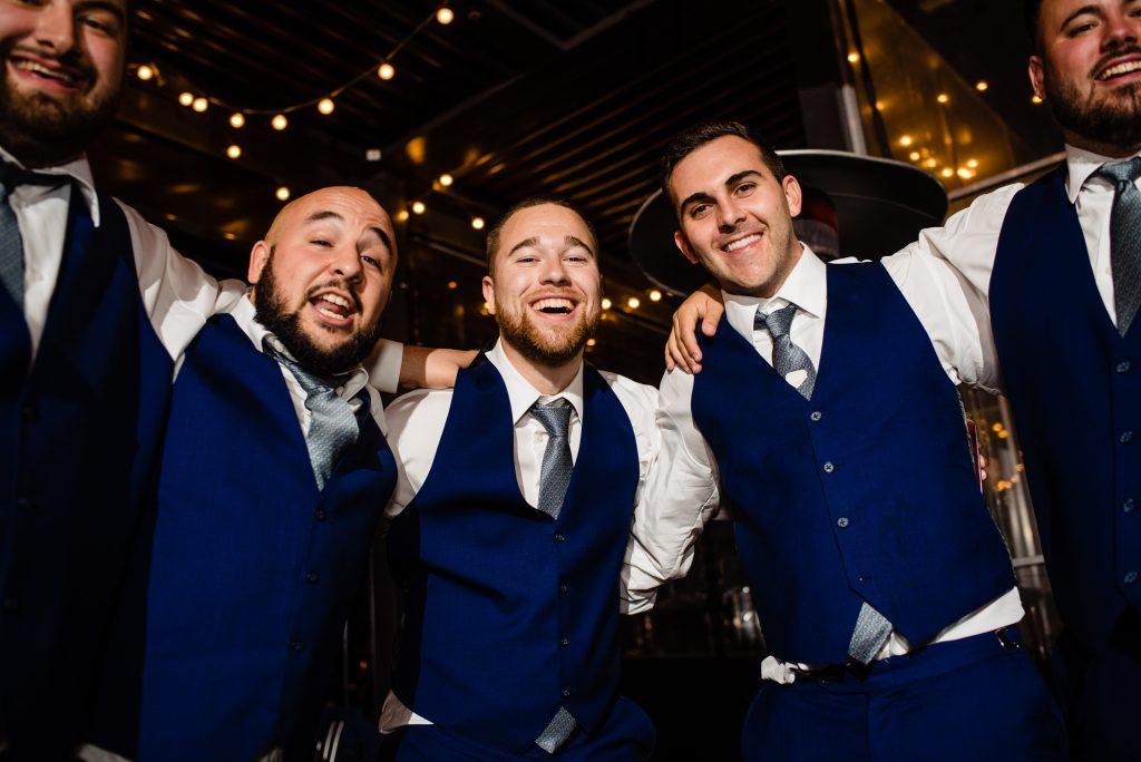 groomsmen at wedding reception