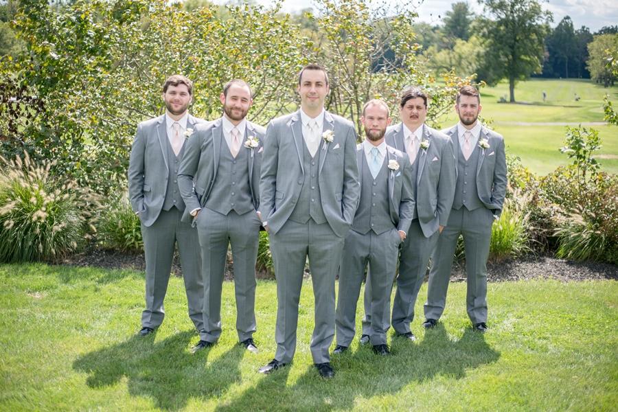 groom and groomsmen wearing gray suits
