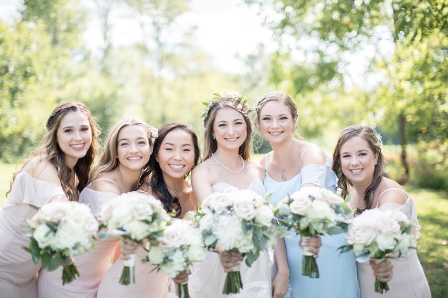 bride and bridesmaids in pastels
