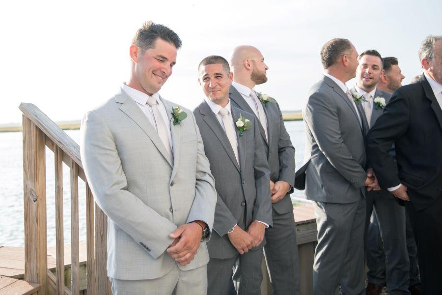 groom waits for bride at ceremony
