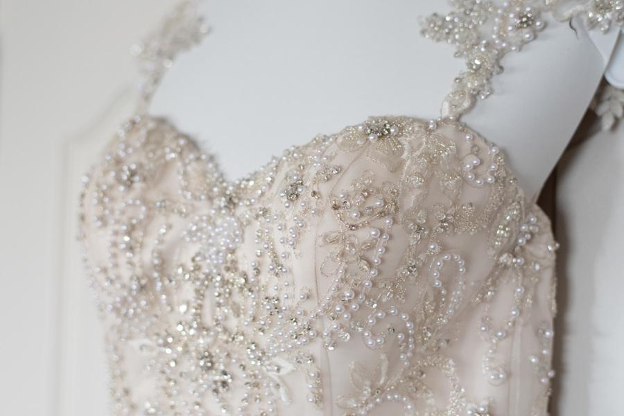 mermaid wedding dress with sweetheart neckline and encrusted pearls 