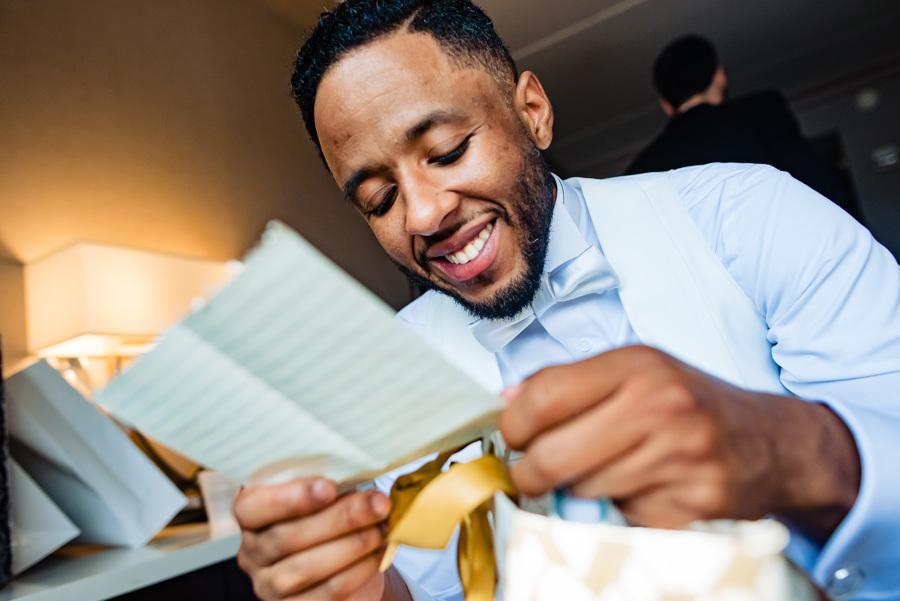 groom reads card from bride