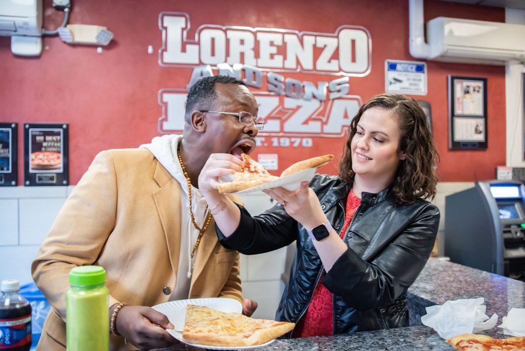 couple sharing pizza slices
