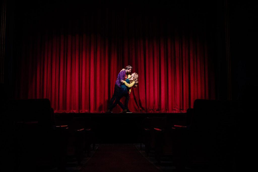 engaged couple dance onstage