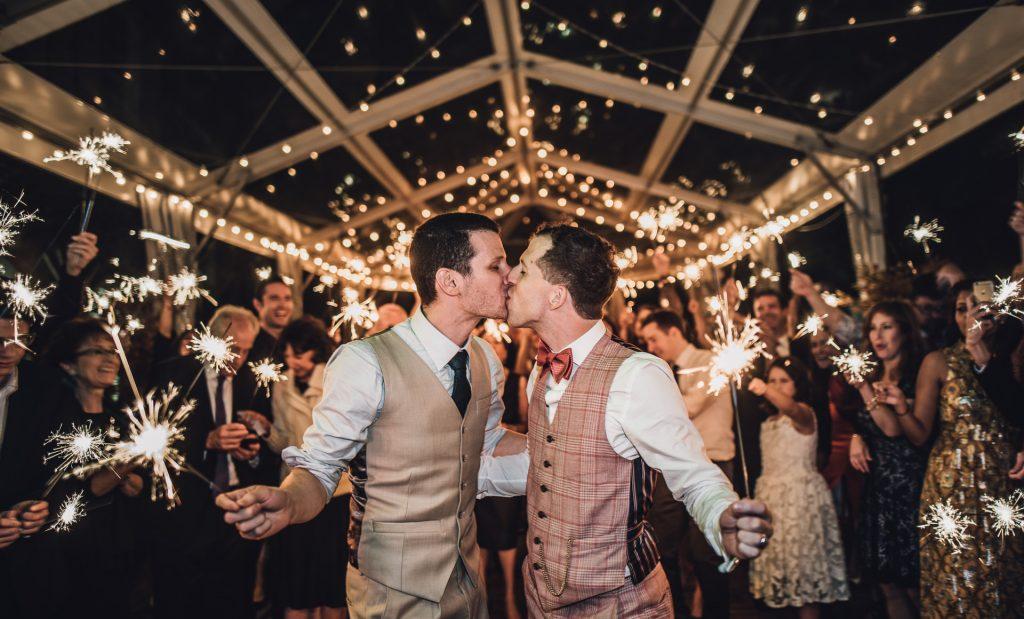 Philadelphia wedding photographers, salt and sonder studio, gay wedding couple sparkler exit kissing, lgbt